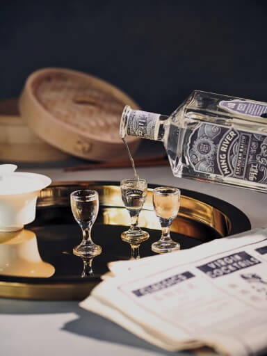 Bottle of Ming River Baijiu pouring into glass