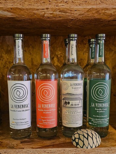 Four La Venenosa bottles line the shelves of the Black Pepper and Basil wine rack