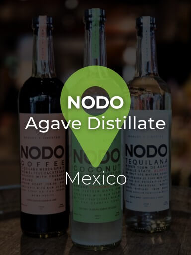 Three bottles of Nodo agave distillate on a bar counter_1