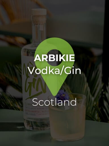 Bottle of Nàdar gin from Arbikie on the table with cocktail next to it_1