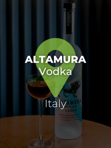 Bottle of Altamura Vodka with glass next to it._1