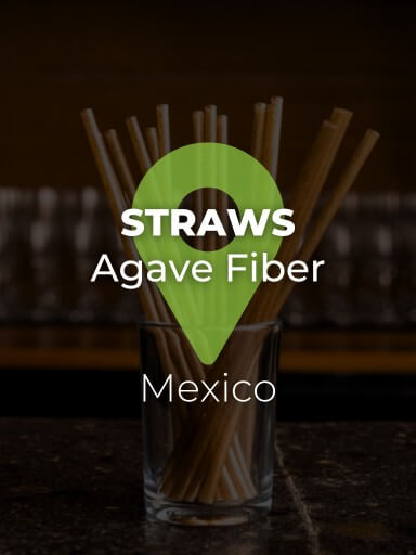 Sustainable agave fiber straws in a glass on a bar counter._1